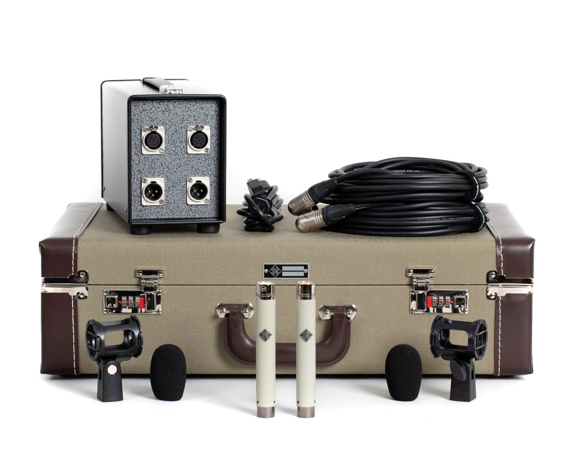 Stereo microphone set with two small microphones, shock mounts, cables, adapter box, and carrying case on white background.