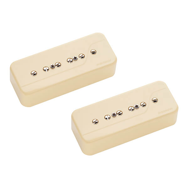 Two cream-colored rectangular guitar pickups each with six metal pole pieces visible on the top.