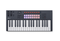 Compact keyboard MIDI controller with 37 keys, control knobs, pads, wheels, buttons and a small display screen.