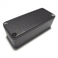 Small black rectangular metal enclosure with screw holes at corners on top surface.