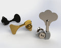 Two metal bass guitar tuning pegs, one gold and one silver, shown on a light background.