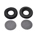 Two black ear pads and two round gray foam covers for headphones shown on a white background.