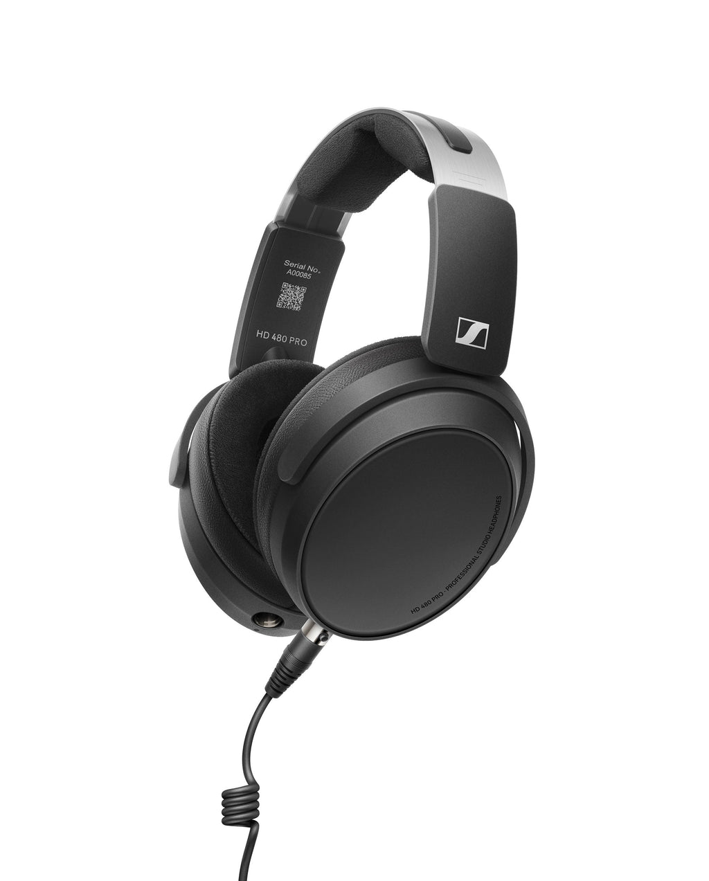 Black over-ear headphones with coiled audio cable connected and visible serial number inside headband.