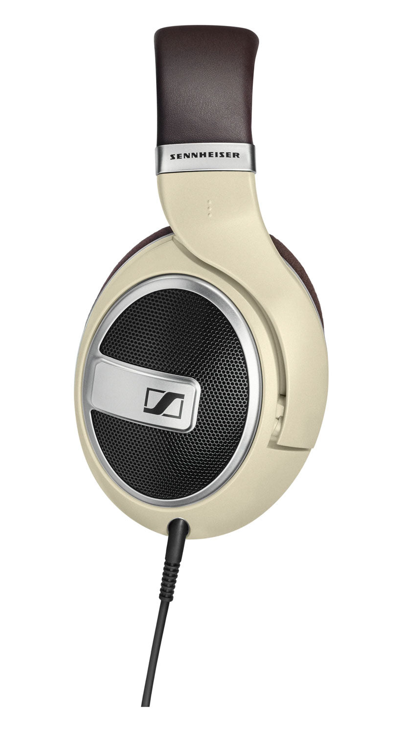 Beige and brown over-ear wired headphones with black mesh ear cup and visible SENNHEISER branding on headband.