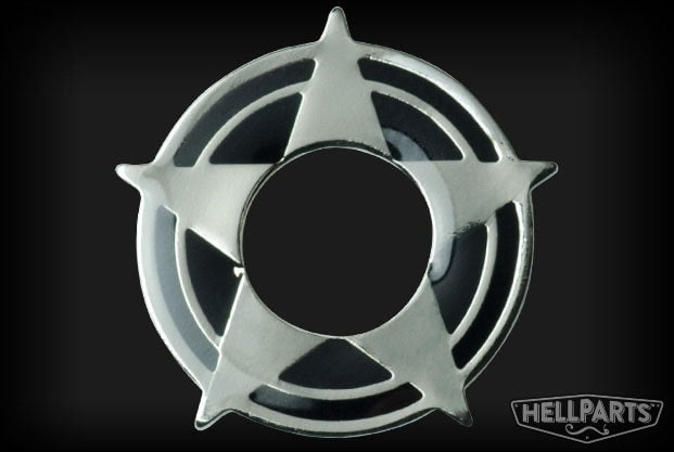 Silver metal decorative washer with a star shape and circular cutouts on a black background
