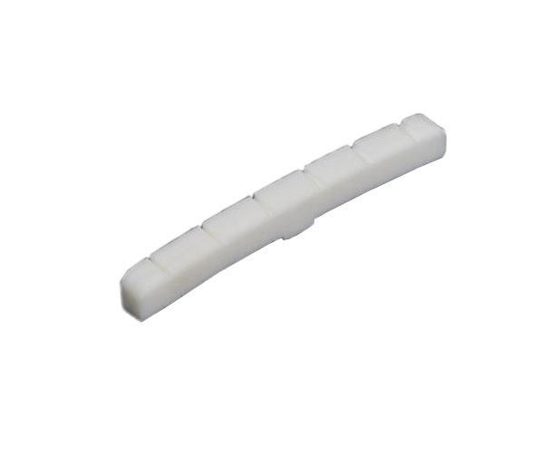 White curved guitar nut with six string slots visible on a neutral background.