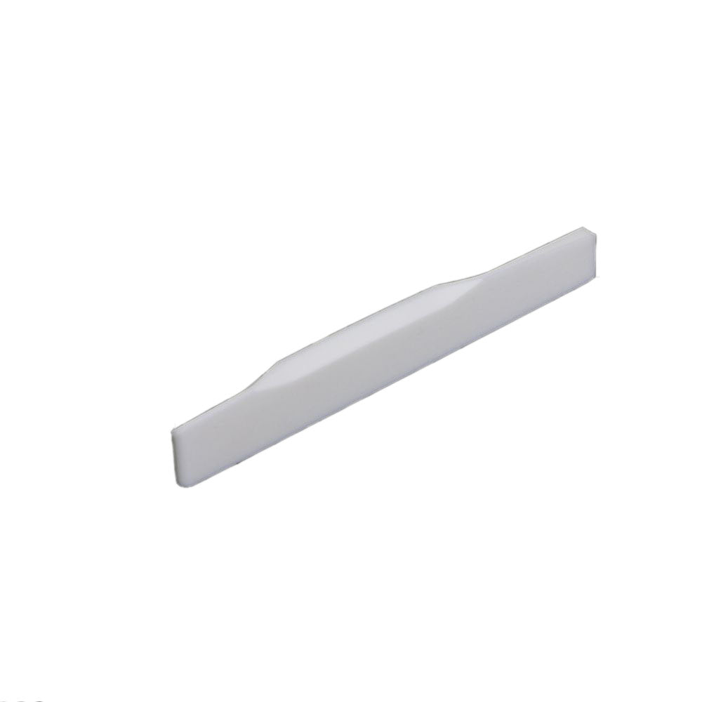 White shaped guitar saddle with a stepped design on a white background.