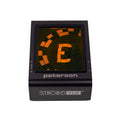 Black Peterson Strobe Vue tuner device with an orange digital display showing the note and tuning indicator.