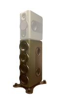 Tall multi-driver studio speaker module in olive green on a black stand with a faded background speaker.