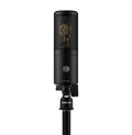 Black cylindrical microphone with perforated grille and mounting bracket labeled SHURE and KSM32C.