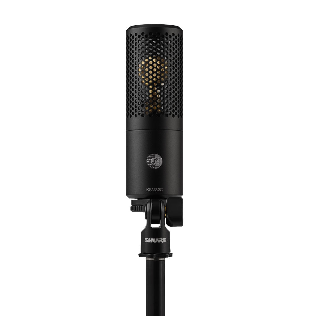 Black cylindrical microphone with perforated grille and mounting bracket labeled SHURE and KSM32C.