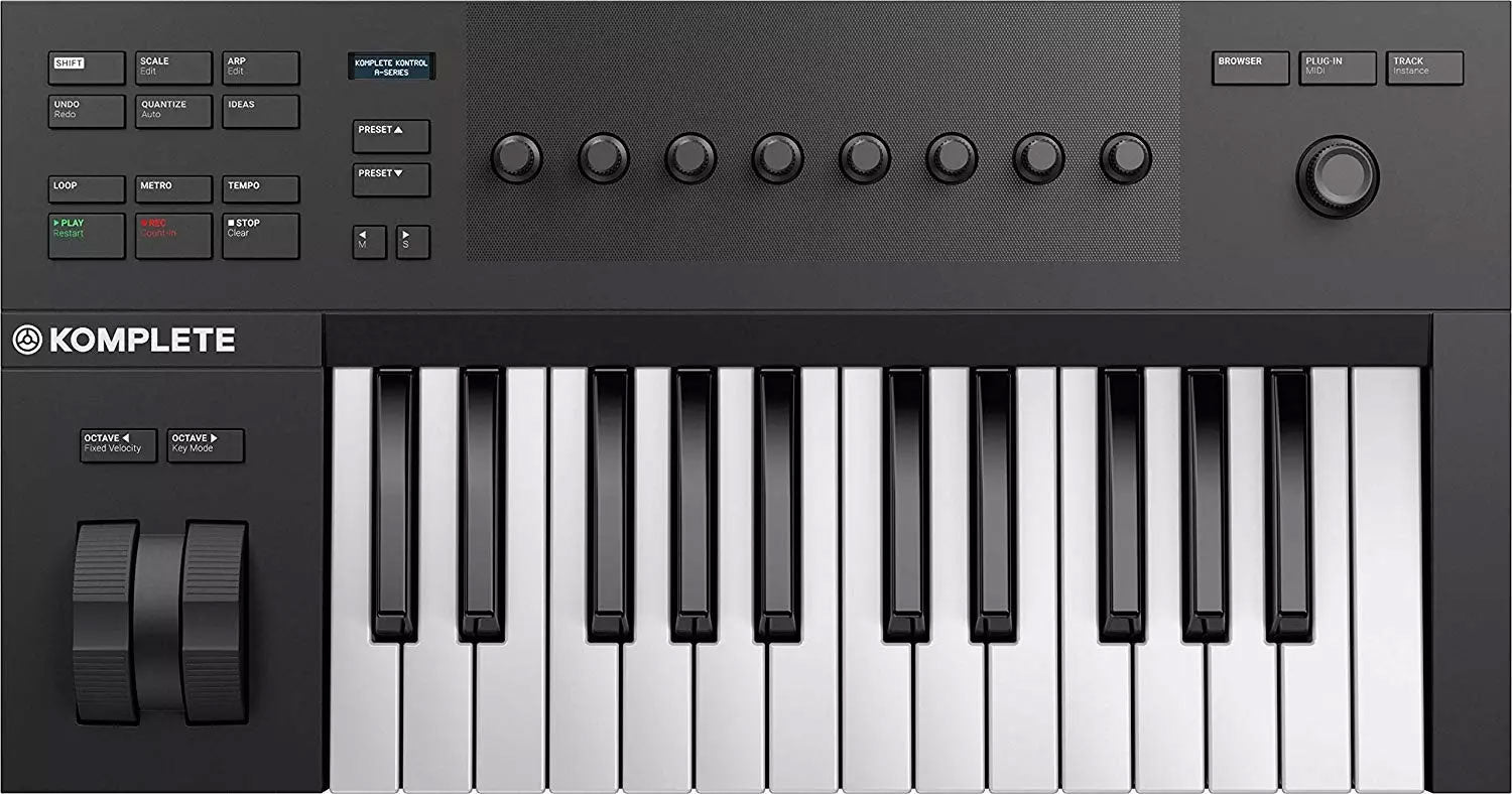 Black and white MIDI controller keyboard with buttons, knobs, and pitch/modulation wheels on top panel.