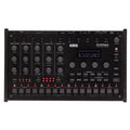 Top view of a black Korg drum machine with multiple knobs, buttons, a display screen, and various input/output ports.