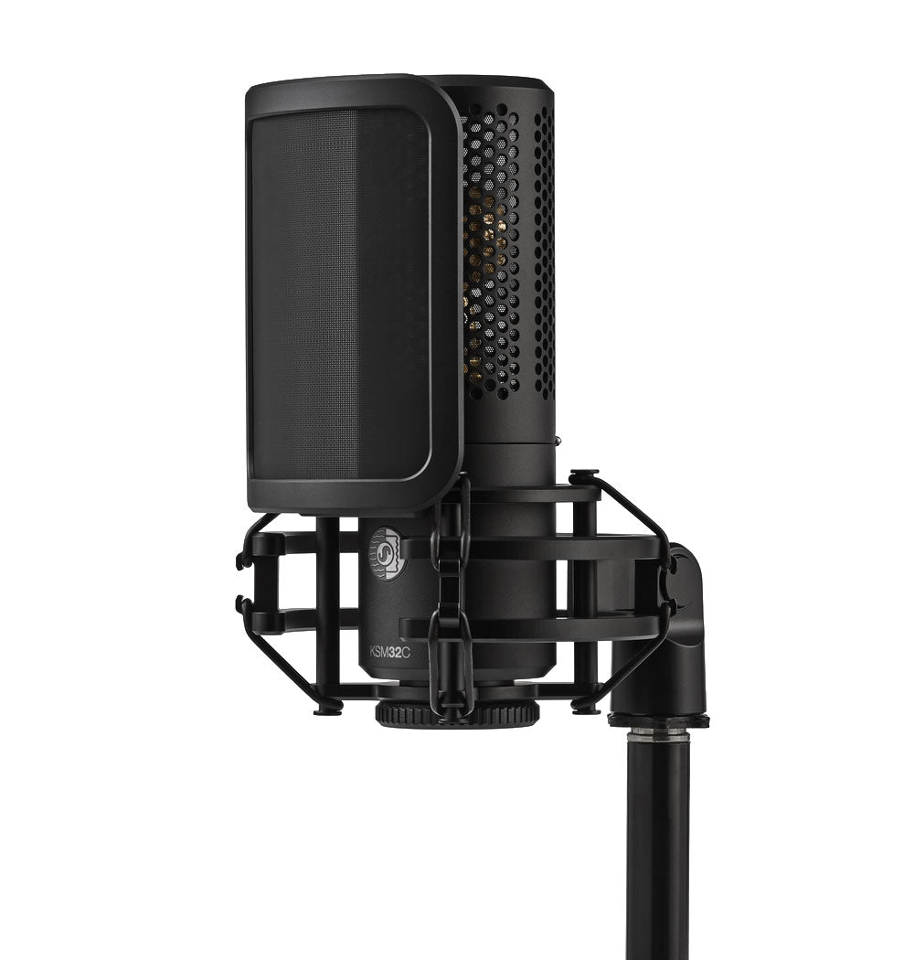 Black Shure KSM32C microphone with shock mount and pop filter on a microphone stand