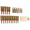 Sets of gold-colored banana plug connectors and metal terminal lugs with holes arranged on a white background