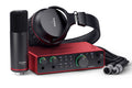Red Focusrite Scarlett 2i2 audio interface with black Scarlett CM25 MKII microphone, headphones, and cables.