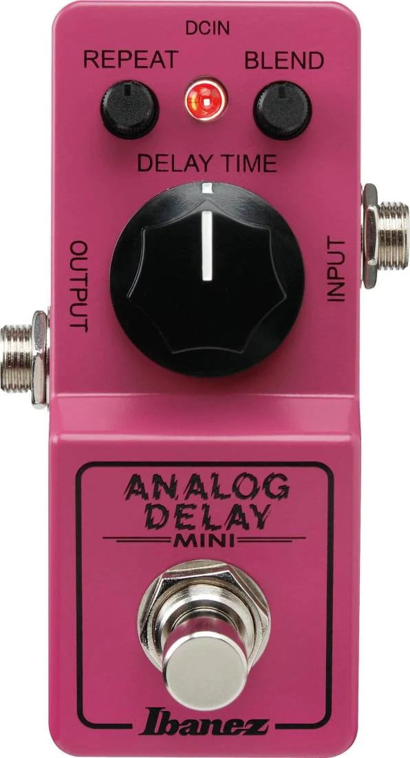 Pink Ibanez Analog Delay Mini guitar pedal with three control knobs, two audio jacks, a footswitch, and a red indicator light.