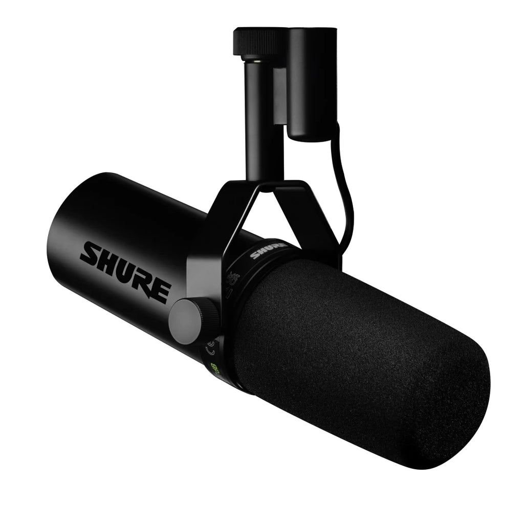 Black dynamic microphone with foam windscreen and mounting bracket showing brand name SHURE.