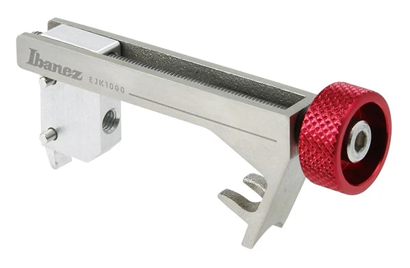 Silver metal guitar intonation adjuster with red knurled knob and Ibanez branding on side