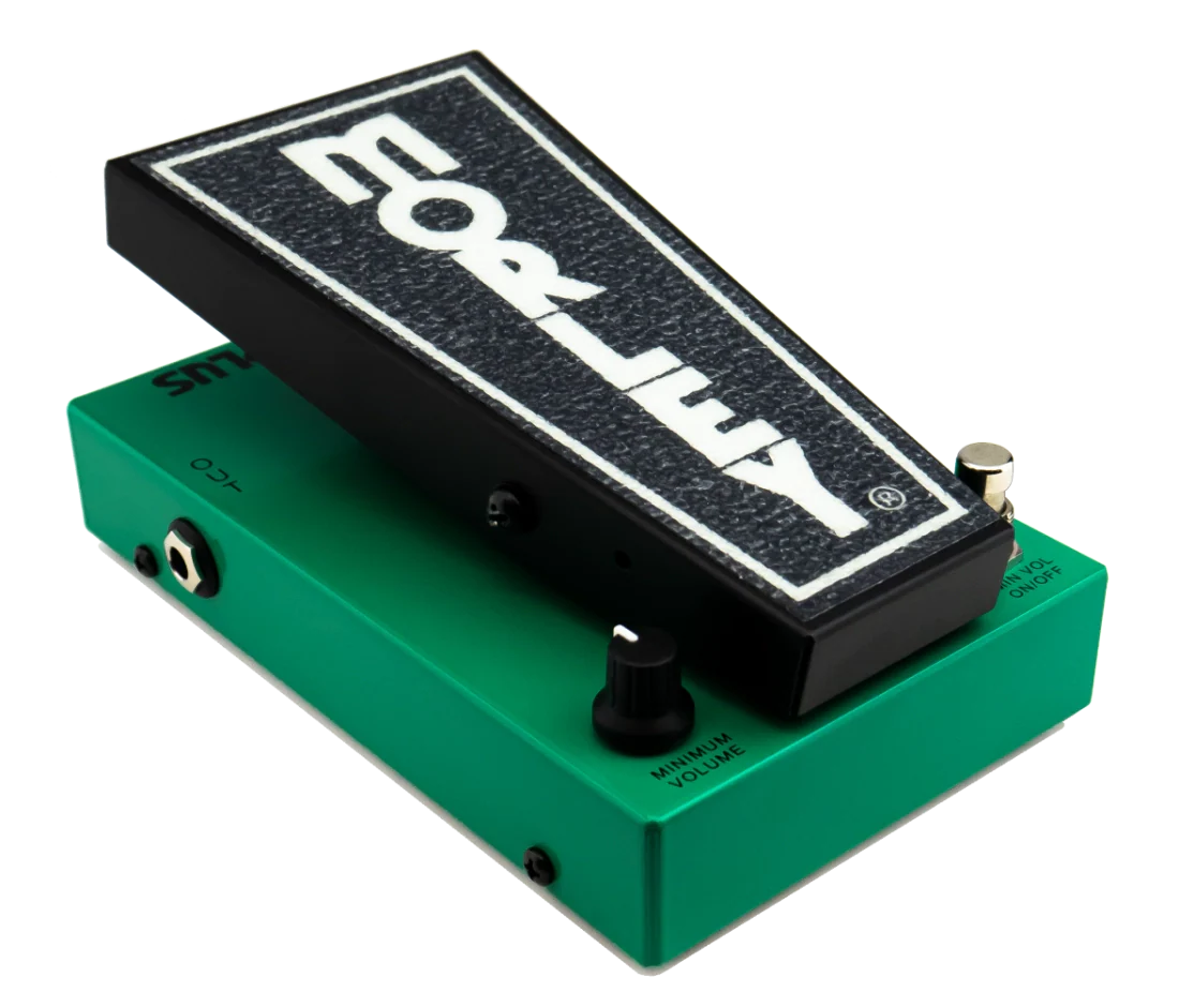 Green and black volume pedal with a foot pedal, control knob, toggle switch, and audio jack input.