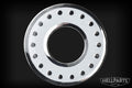 Round metal washer with white center and evenly spaced rivets around the edge on a black background.