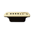 Cream colored guitar pickup with six black metal pins and L.R. Baggs logo on top surface.