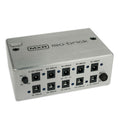 Silver MXR iso-brick power supply with multiple barrel power jacks and a rotary voltage dial.