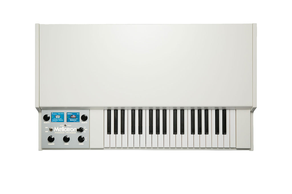 White keyboard synthesizer with control panel featuring knobs, toggle switch, and display screens showing instrument names.
