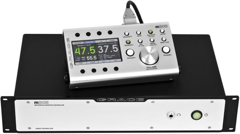 Monitor controller device with control unit displaying volume and settings on screen and rack mount unit below.