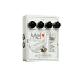 White guitar effects pedal with four knobs, footswitch, and side input/output jacks labeled Mel 9.