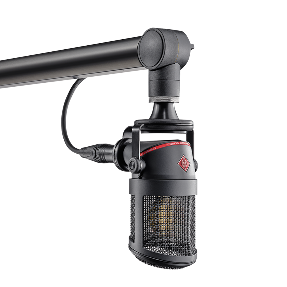 Black studio microphone suspended from a black adjustable microphone arm with visible red and silver branding details.