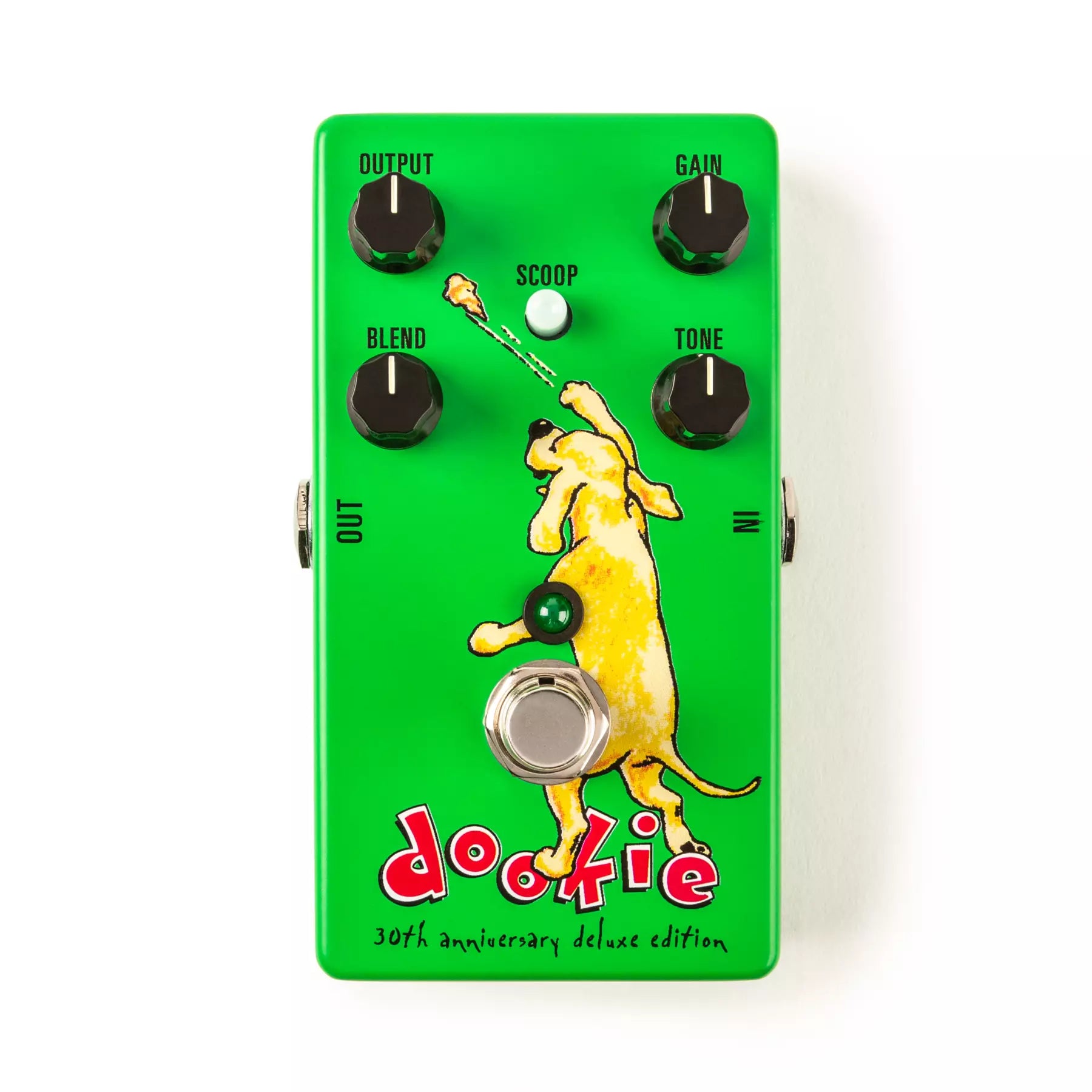 Green overdrive pedal with dog graphic and control knobs labeled output, gain, blend, tone, and a scoop switch.