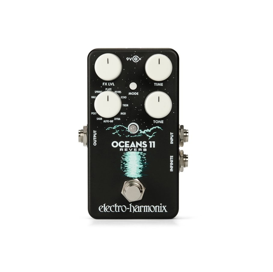 Black guitar effects pedal with four white knobs, a footswitch, and multiple 1/4 inch jacks.
