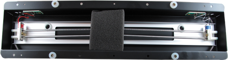Rectangular metal reverb tank component with black foam padding and wires inside a black frame.