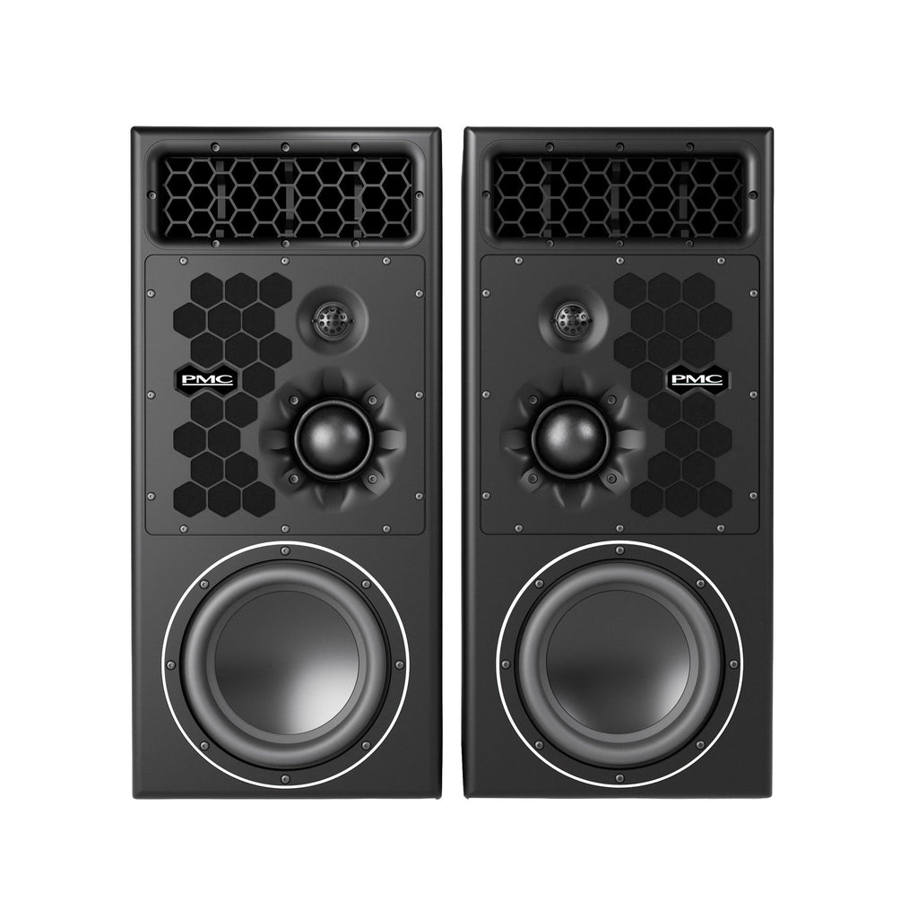 Front view of a pair of black PMC studio monitors with honeycomb pattern and visible drivers.