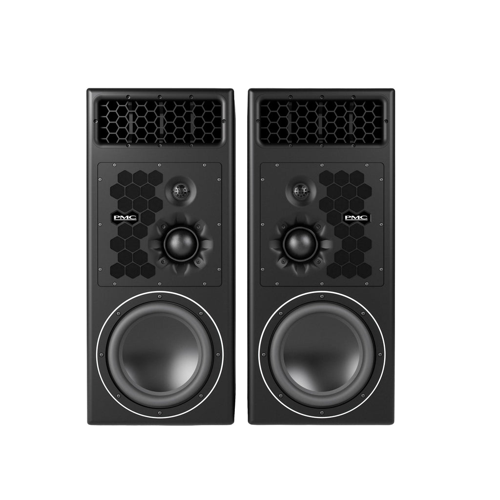 A large PMC PMC12 three-way active studio monitor with a black cabinet, drivers arranged vertically on the front baffle: a 12-inch bass driver, a mid-dome, and a soft-dome tweeter in a waveguide.