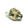 Silver metal stereo switch jack socket with beige plastic insulators and mounting nut