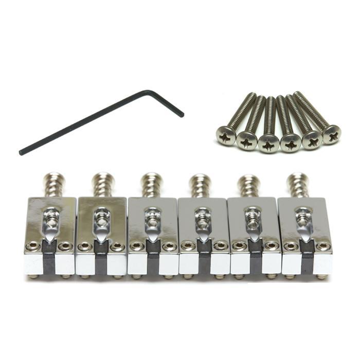Six chrome metal string saddles with six screws and one hex key laid out on a white surface.