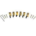 Set of six gold guitar saddles with screws, bolts, and a hex key arranged on a white background.