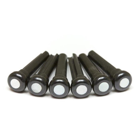 Six black bridge pins with white circular dots arranged in a row on a white background.