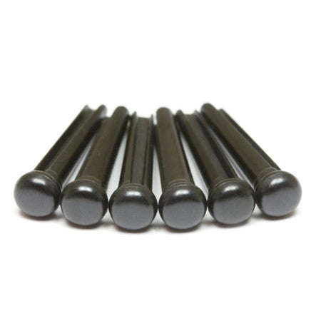 Six black bridge pins arranged in a row on a white background.