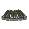 Six black cylindrical bridge pins with rounded tops arranged in a row.