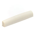 Whiteish rectangular guitar nut with a curved top and flat base on a white background.