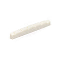 White plastic guitar nut with six evenly spaced string slots on a flat bottom surface.