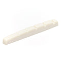 White slotted guitar nut with six string slots and a flat bottom