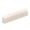 White slotted guitar nut with six string slots visible in a close-up side view.