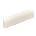 Off-white slotted guitar nut with six grooves for strings.