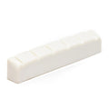White slotted nut with six notches for string spacing, designed for a guitar or similar instrument.
