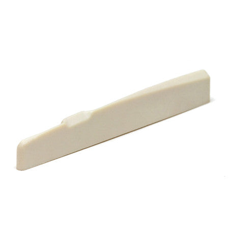 Off-white plastic guitar saddle piece with a curved notch on one end.