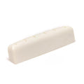 Off-white slotted nut or guitar saddle with six evenly spaced slots, shown at an angle on a white background.